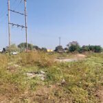 Industrial land plot with road access highlighting legal documents required before buying industrial land