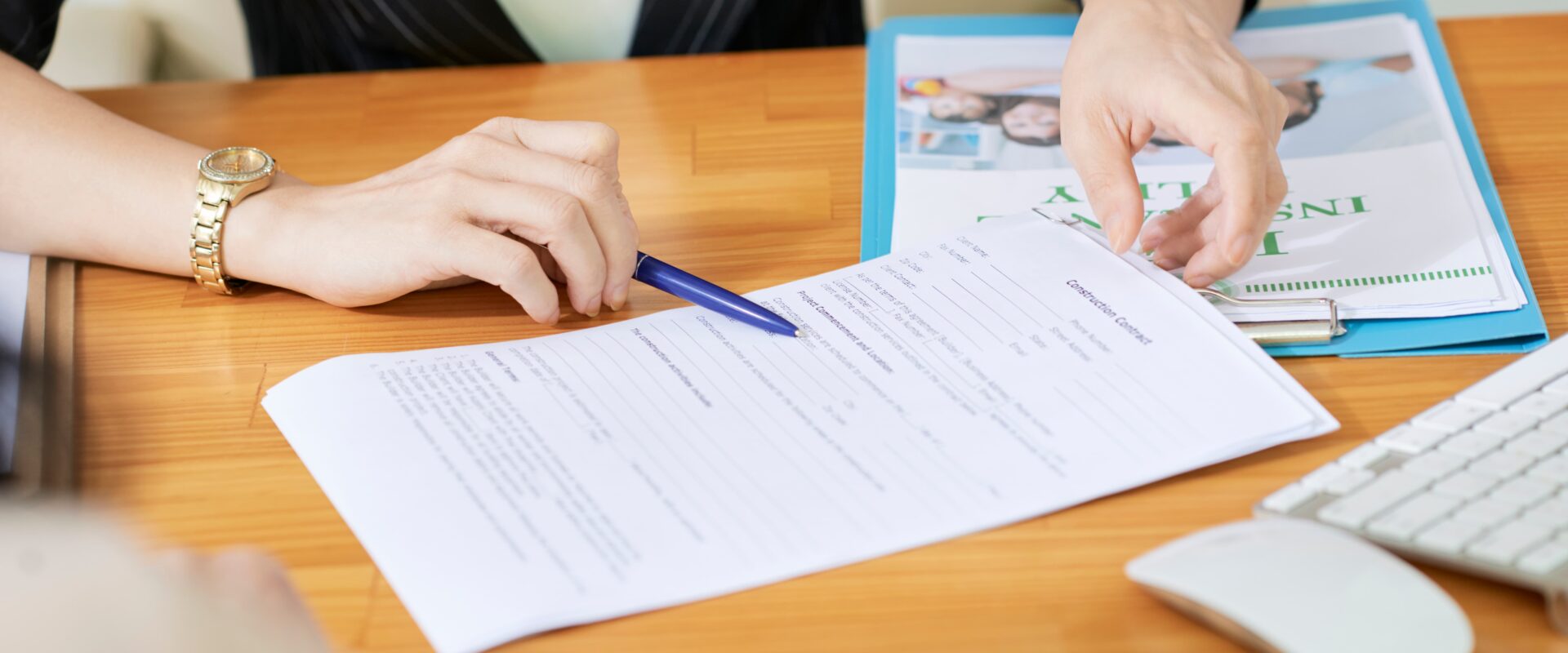 Real estate consultant explaining essential property documents to a client before buying property in Vadodara.